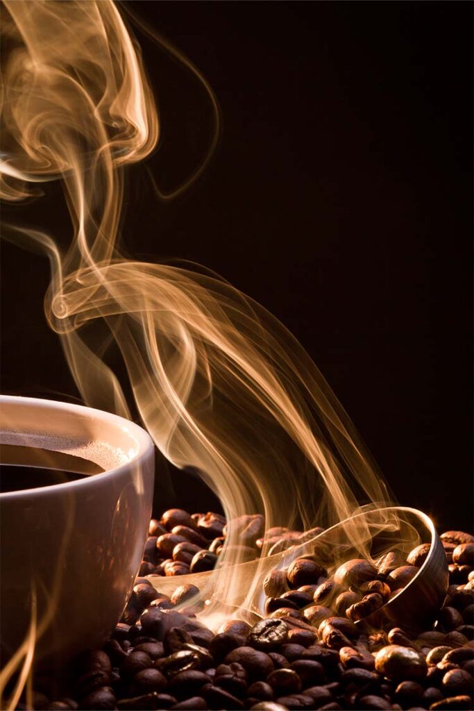 a cup of coffee with smoke coming out of it