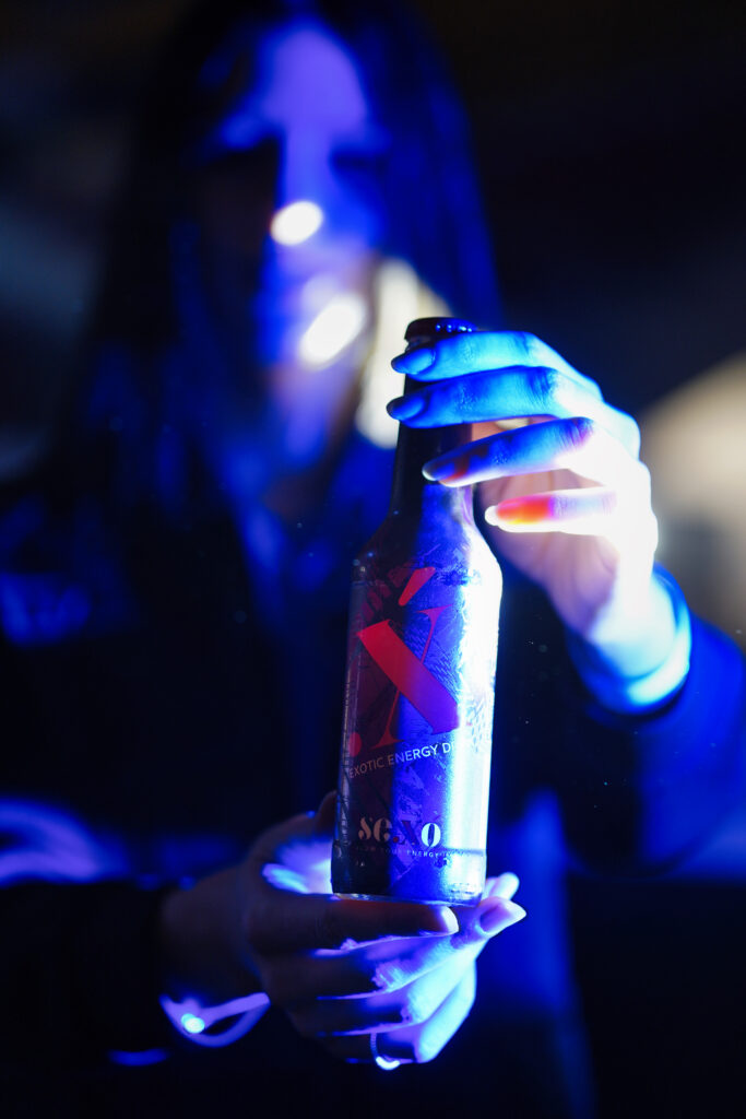 a person holding a beer bottle